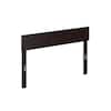A dark brown wooden full headboard with metal accents on a white background.