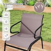 Single patio chair in a green outdoor setting.
