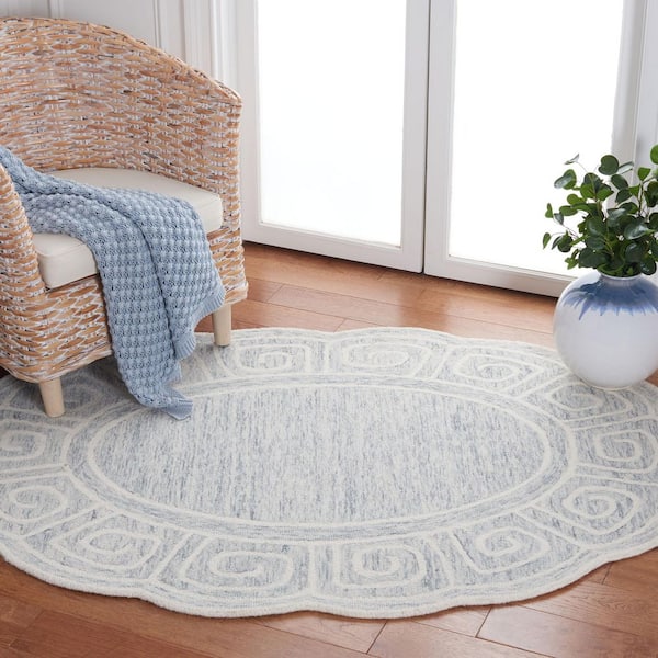Novelty 5 ft. x 7 ft. Light Gray/Ivory Swirl Border Oval Area Rug