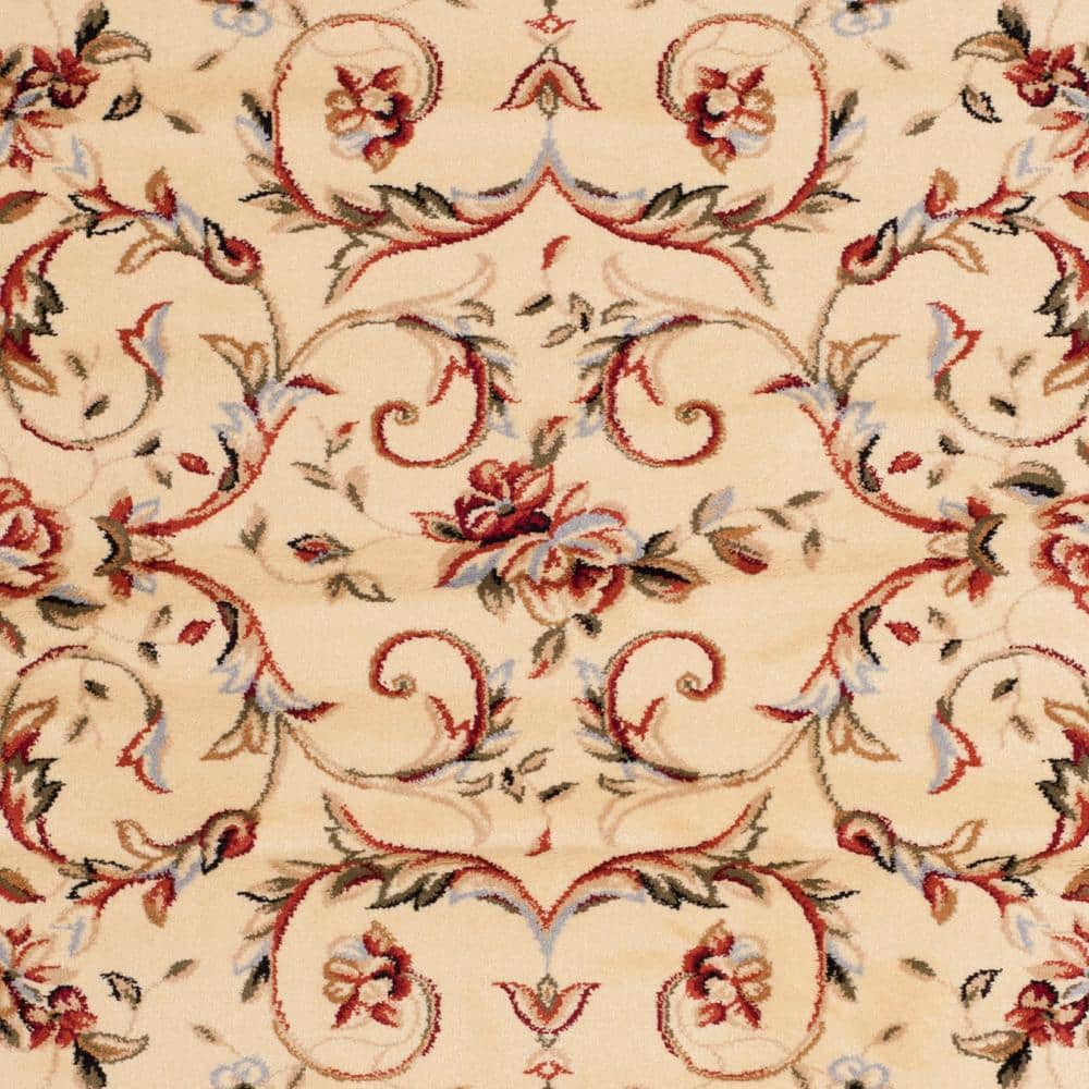 Ivory Floral Bordered Synthetic Area Rug 5'3" x 7'6"