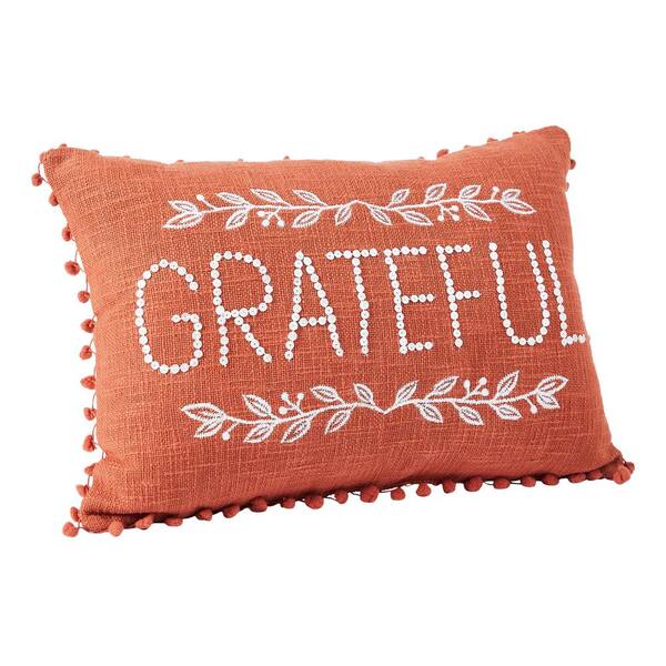 Orange pom pom cushion best sale