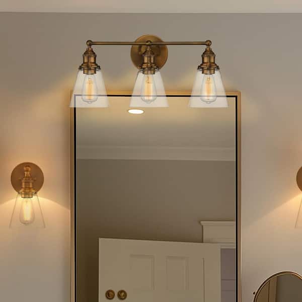Barwell 24 in. 3-Light Oxidized Aged Brass Vanity Light with Clear Glass Shades