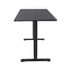 Black electric standing desk viewed from a high angle.