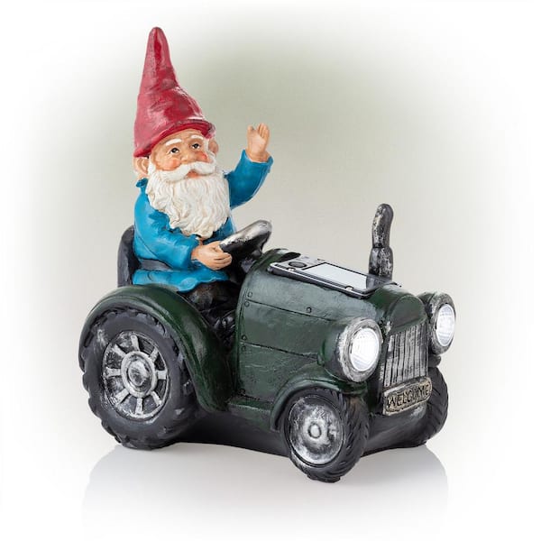 Alpine Corporation 10 in. Tall Outdoor Garden Gnome Riding Green Tractor Yard Statue Decoration with LED Lights, Multicolor