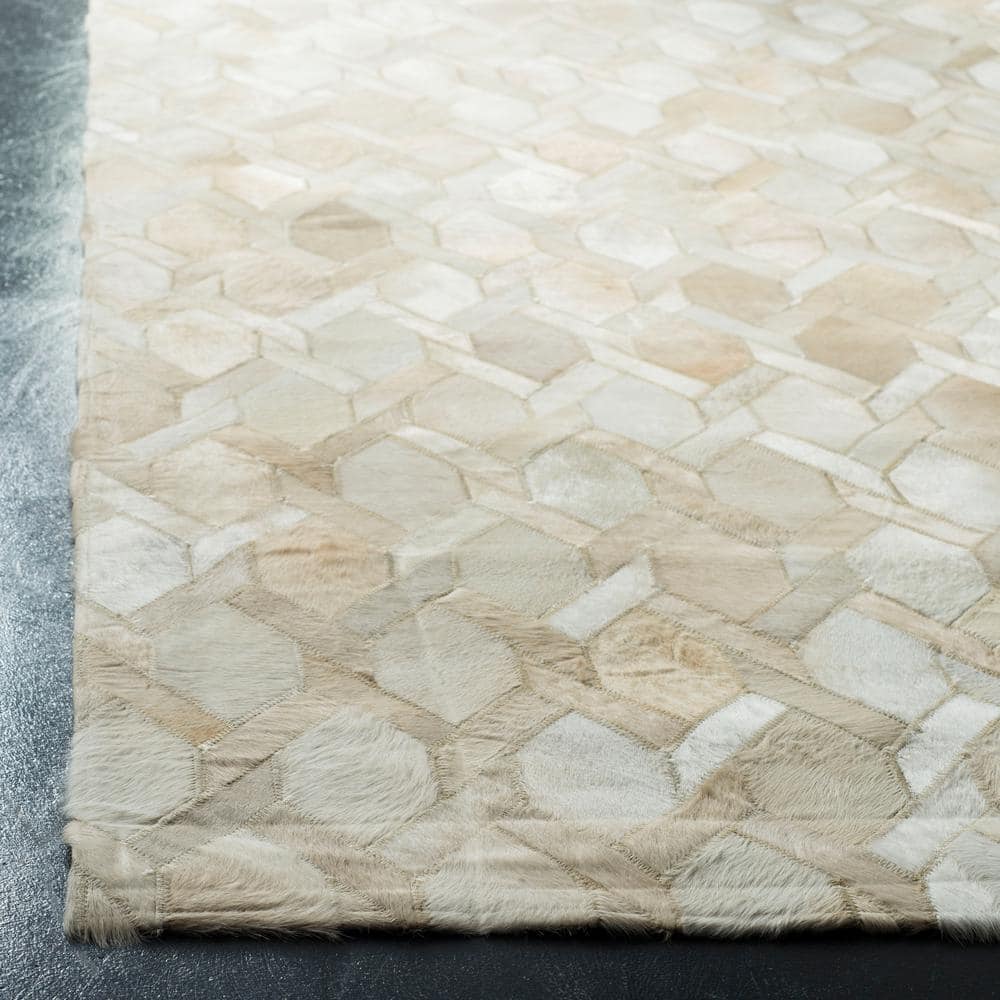 Ivory Geometric Handmade Wool and Cowhide Area Rug