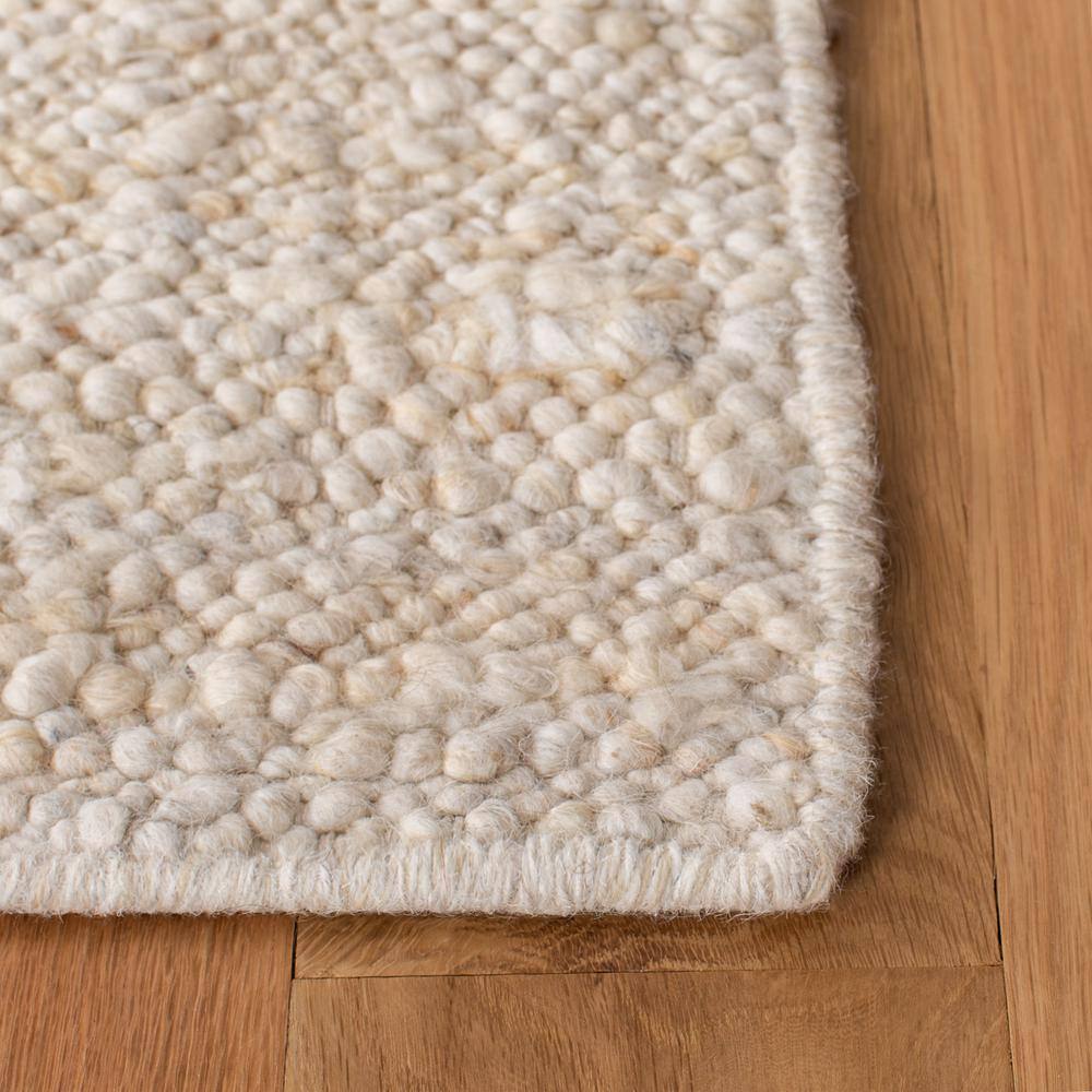 Ivory Handwoven Wool Rectangular Area Rug 5' x 8'