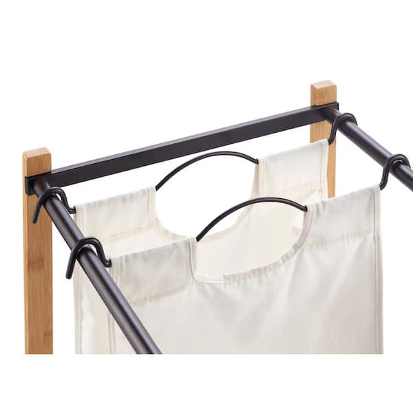 https://images.thdstatic.com/productImages/68560264-9731-4281-b01c-dfa977bd372e/svn/bamboo-frames-and-bronze-poles-trinity-laundry-sorters-tbfpbr-2104-1f_600.jpg