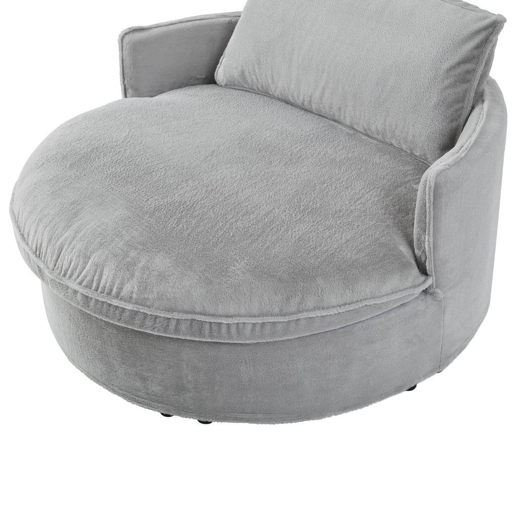 Angled view of the grey faux rabbit fur arm chair.