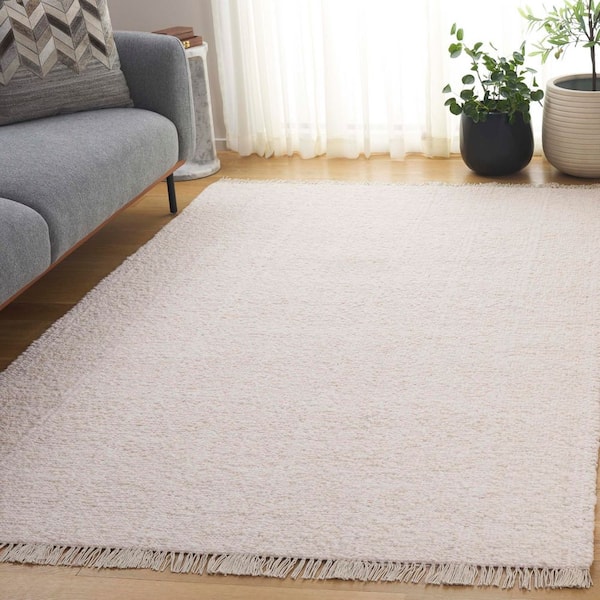 Manhattan 9 ft. x 12 ft. Ivory Solid Color Distressed Area Rug