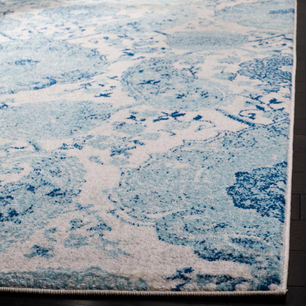 Beige and Turquoise 4' x 6' Synthetic Reversible Area Rug