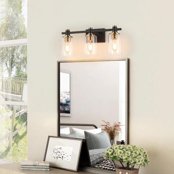17 in. 3 Light Black and Gold Vanity Light with Clear Glass shade