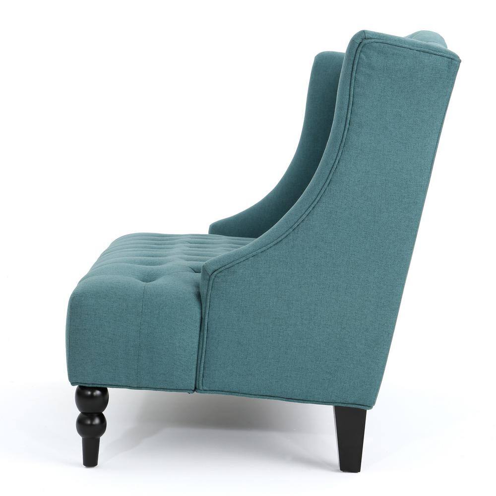 Side view of a dark teal tufted velvet armless loveseat showing the high back and curved silhouette.