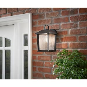 Ashton 10.87 in. 1-Light Black Outdoor Wall Light Sconce Lantern with Seeded Glass