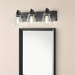 Manor 24 in. 3-Light Matte Black Industrial Bathroom Vanity Light with Clear Glass Shades
