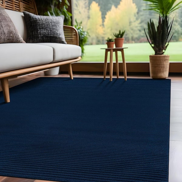 Oasis Solid Navy 6 ft. x 9 ft. Non-Slip Rubber Back Indoor Area Rug
