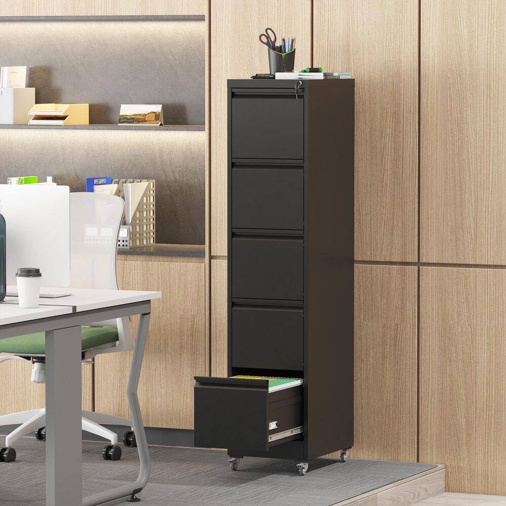 Black storage cabinet in a home office near a desk.