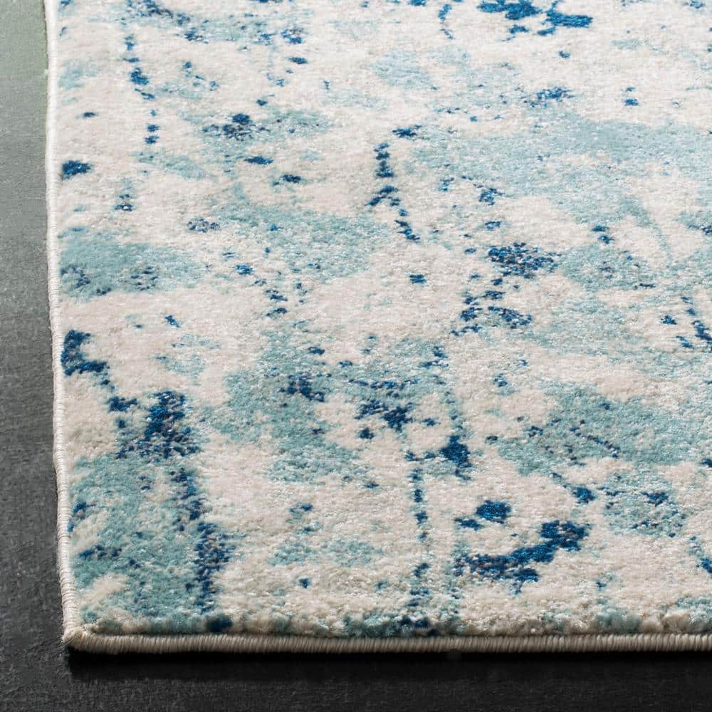 Ivory and Blue Abstract Floral 8' x 10' Area Rug
