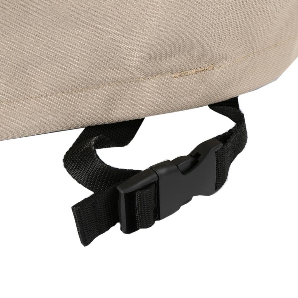 Close-up of the black strap and fastener on the chaise lounge cover.