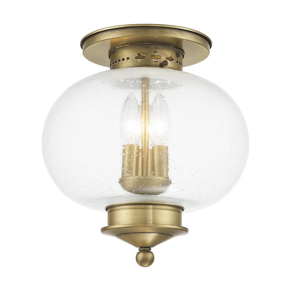 Harbor Antique Brass Globe LED Flush Mount with Hand Blown Seeded Glass