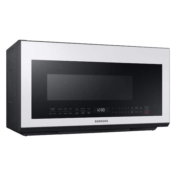 https://images.thdstatic.com/productImages/6a2d974f-3972-413c-a156-069d640031f8/svn/white-glass-samsung-over-the-range-microwaves-me21b706b12-66_600.jpg