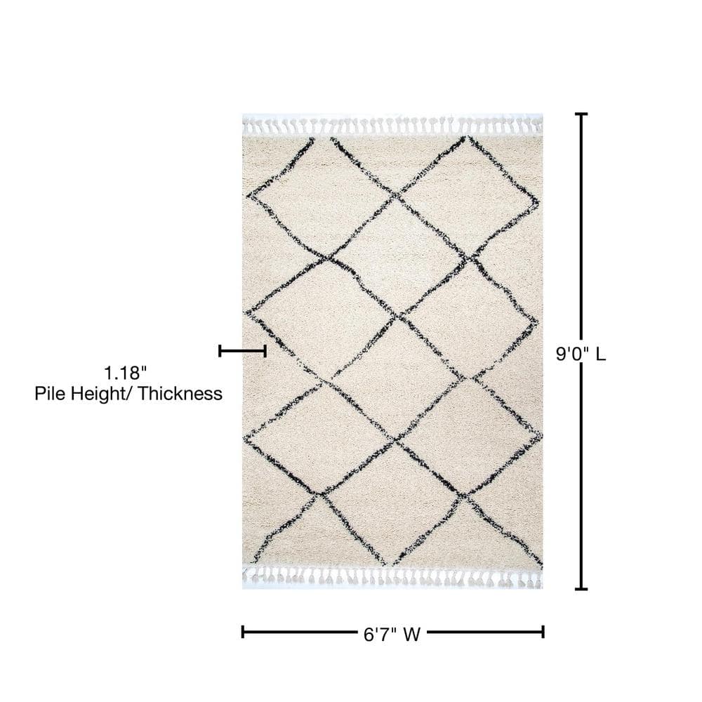 Off-White 6' 7" x 9' Oval Synthetic Shag Area Rug with Tassels