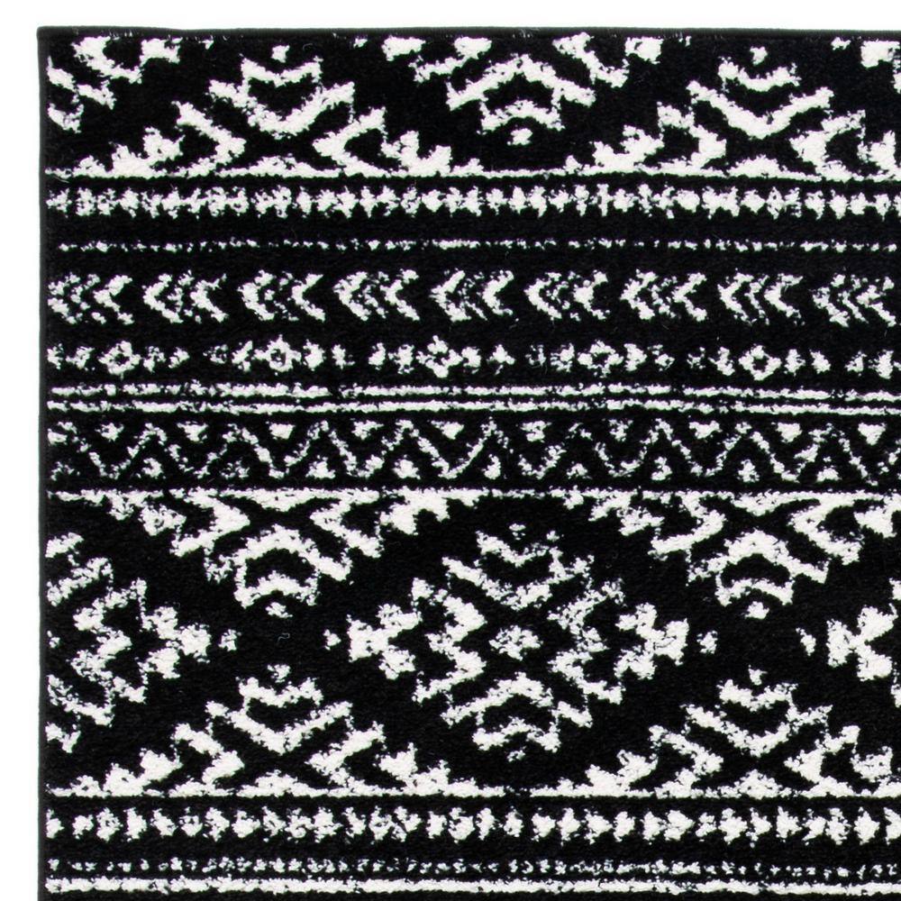 Modern Geometric 4' x 6' Black/Ivory Synthetic Area Rug