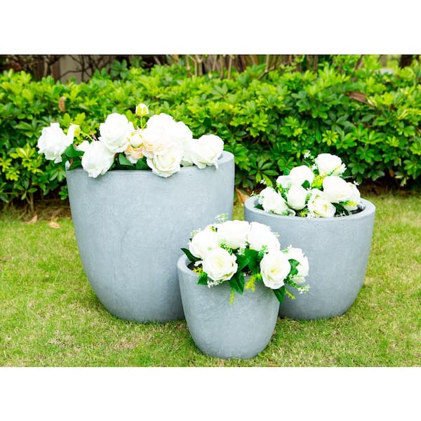 https://images.thdstatic.com/productImages/6a54dcd8-daa9-447e-a90d-e8ec6438a8f2/svn/slate-gray-kante-plant-pots-osc0050abc-c60611-64_600.jpg