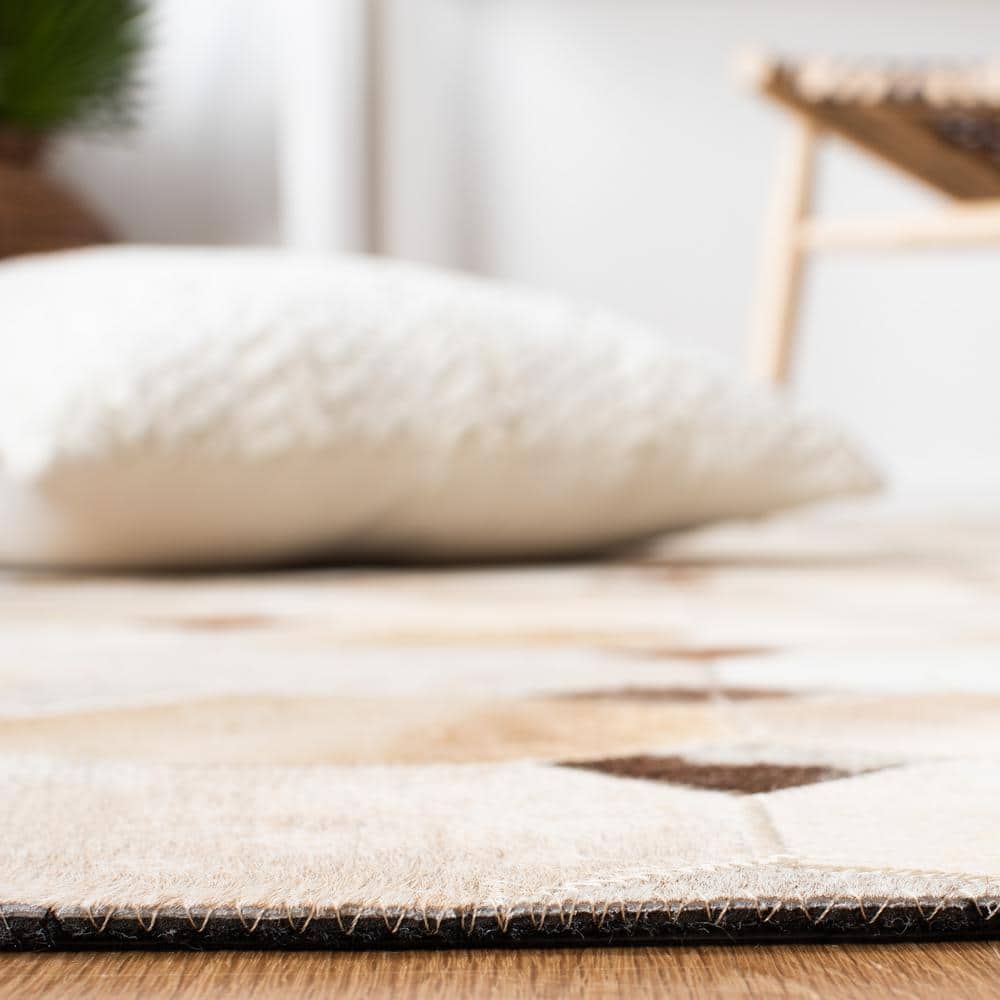 Hand-Stitched Ivory and Brown Geometric Cowhide Rug - 2'3" x 9'