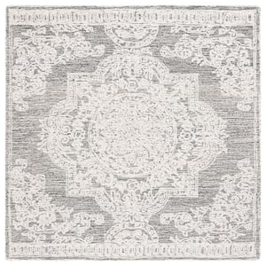 Abstract Ivory/Black 2 ft. x 4 ft. Distressed Medallion Area Rug
