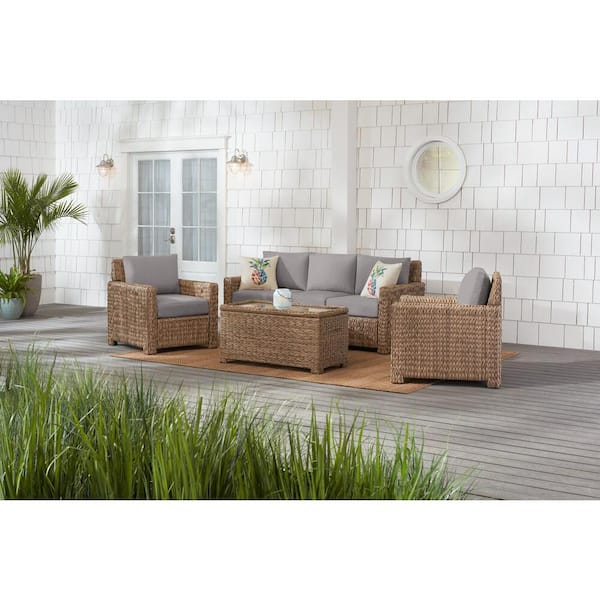 Hampton Bay Laguna Point 4-Piece Natural Tan Wicker Outdoor Patio Conversation Seating Set with CushionGuard Stone Gray Cushions
