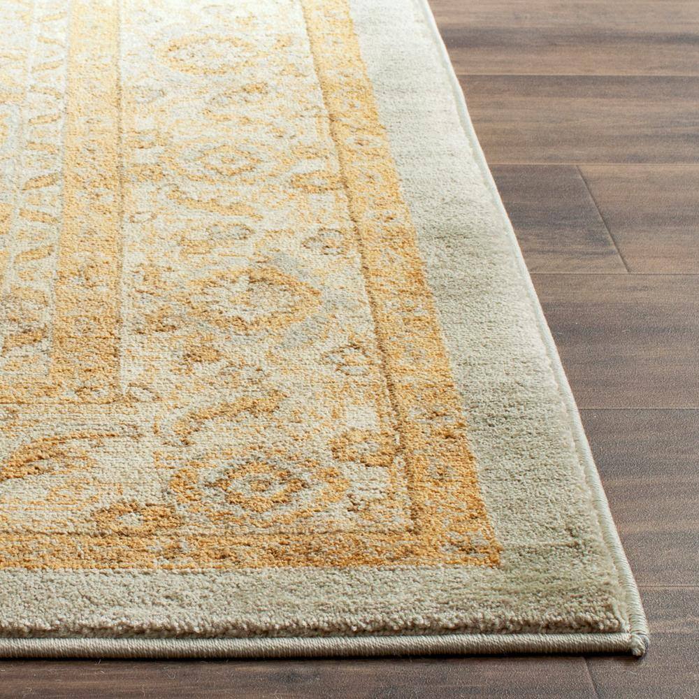 Elegant Light Blue and Gold Floral Bordered 8' x 11' Area Rug