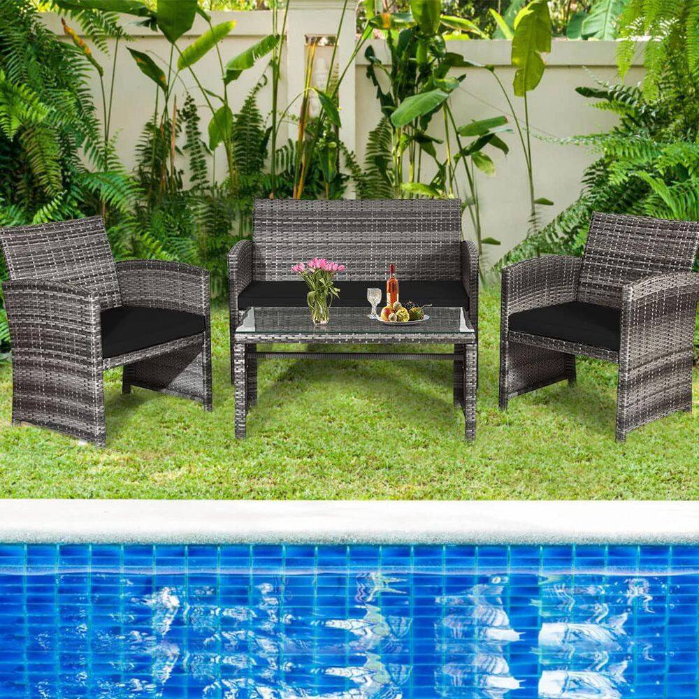 Black 4-Piece Rattan Patio Furniture Set with Glass Table