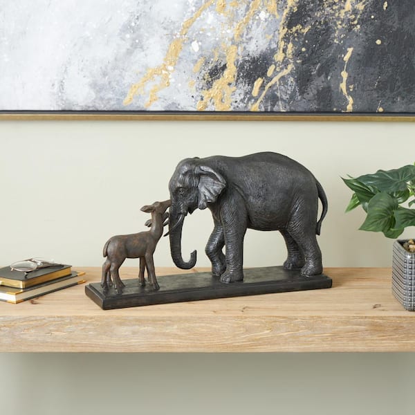 Litton Lane 11 in. x 20 in. Black Resin Walking Elephant Sculpture with Dark Brown Deer