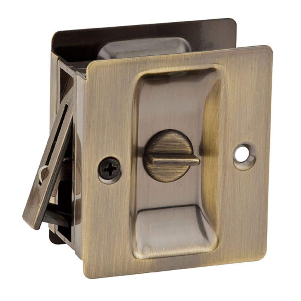 UPC 042049270464 product image for Kwikset Notch Antique Brass Privacy Bed/Bath Pocket Door Lock with Lock | upcitemdb.com