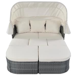 Gray Wicker Outdoor Day Bed with Beige Cushions and Retractable Canopy