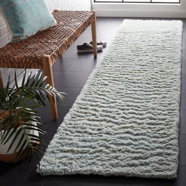 Casablanca 2 ft. x 9 ft. Light Blue Solid Color Flokati Runner Rug
