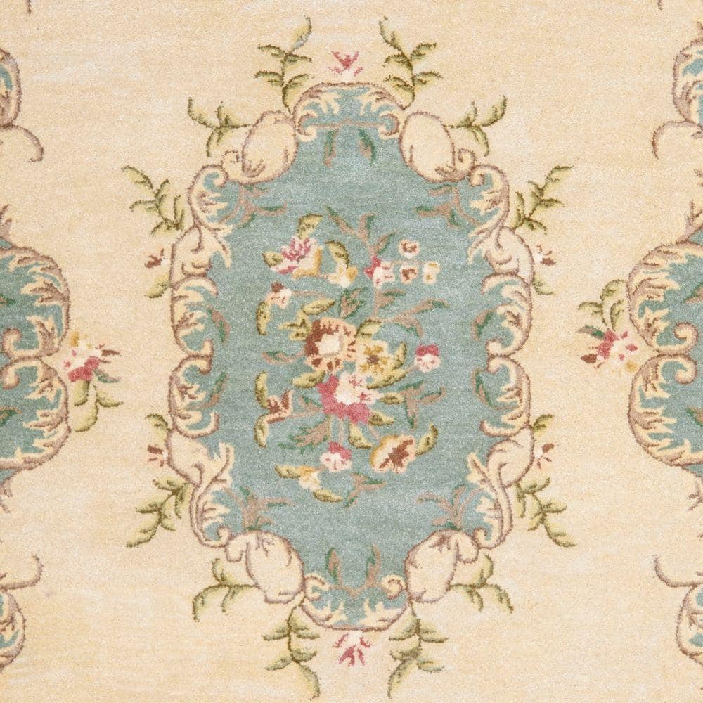 Ivory and Light Blue 6' x 9' Hand-Tufted Wool Area Rug