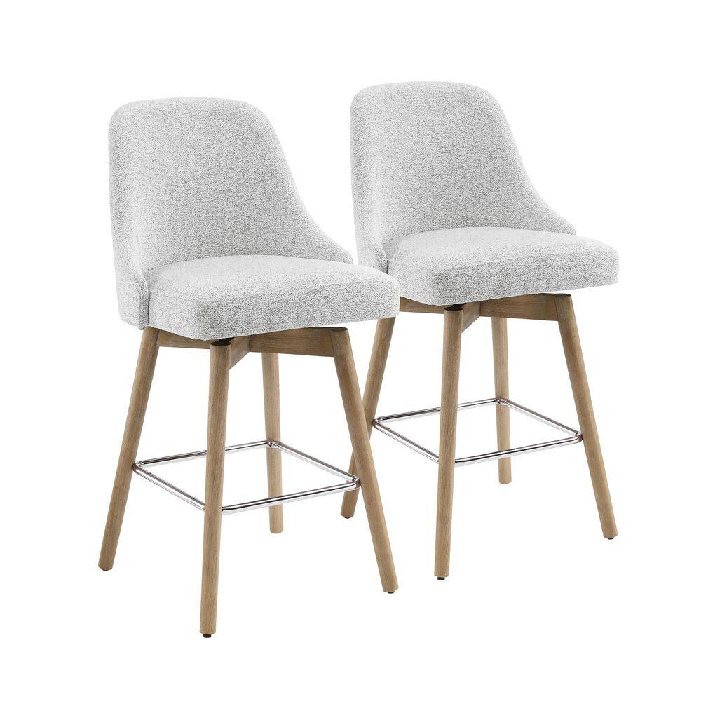 Two white and gray fabric swivel bar stools with light wood legs.