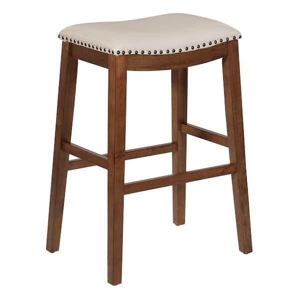 OSP Home Furnishings Metro 29 in. Saddle Stool with Nail Head Accents and Espresso Legs with Cream Bonded Leather