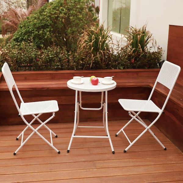 white metal table and chairs garden