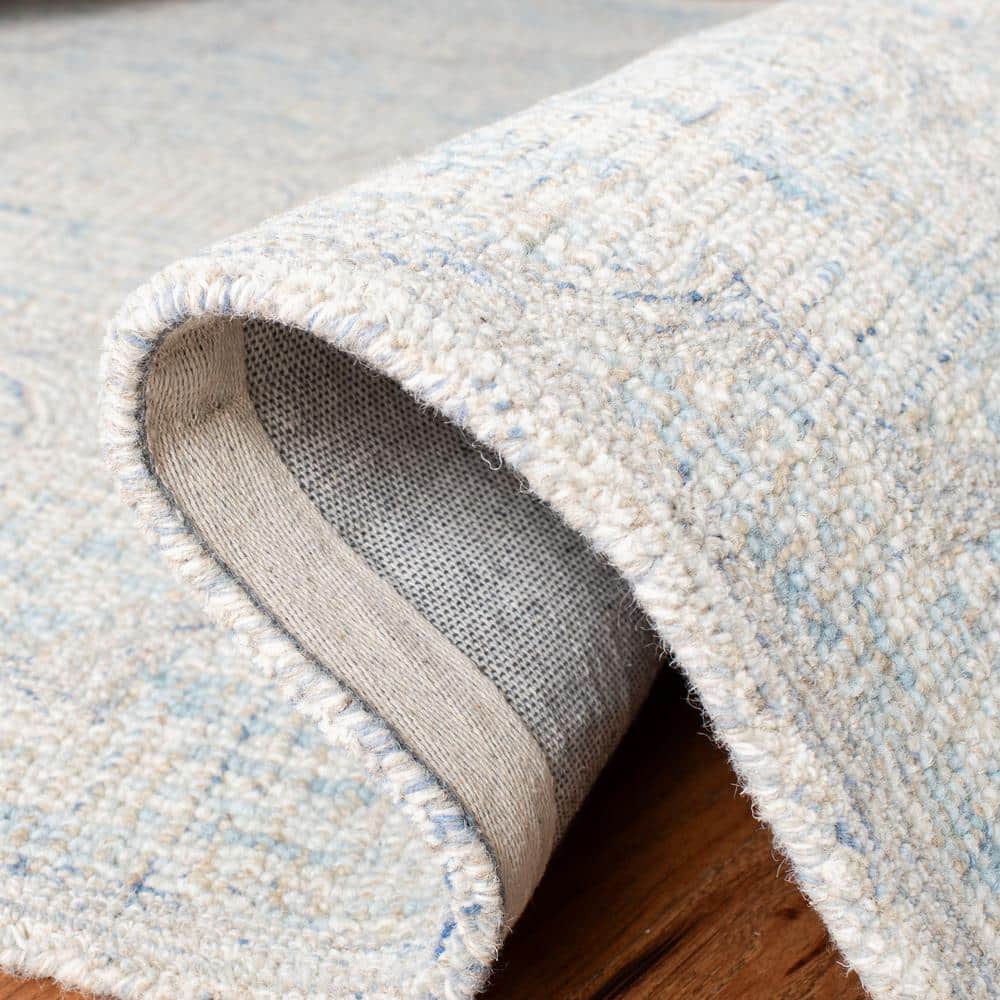 Ivory and Light Blue Handmade Wool Abstract Area Rug