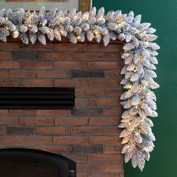 9 ft. Pre-Lit Snow Flocked Artificial Christmas Garland with Warm White LED Lights (2-Pack)
