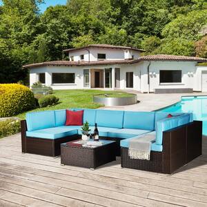 7-Piece Glass Top Wicker Patio Conversation Set with Blue Cushions and 2 Red Pillows
