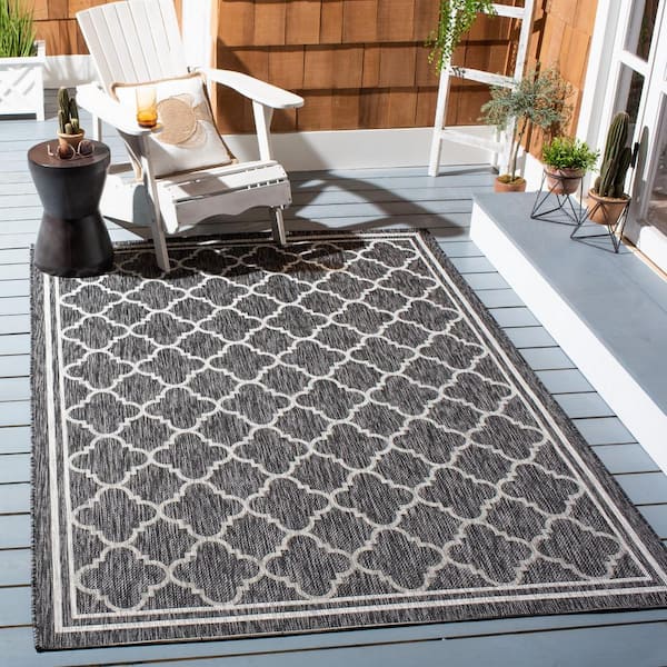 https://images.thdstatic.com/productImages/6c12e89e-97c8-4261-bccb-040b2925b521/svn/black-charcoal-safavieh-outdoor-rugs-cy8918-37621-9-e1_600.jpg