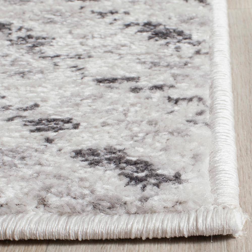 Ivory and Charcoal Chevron 4' Square Synthetic Rug