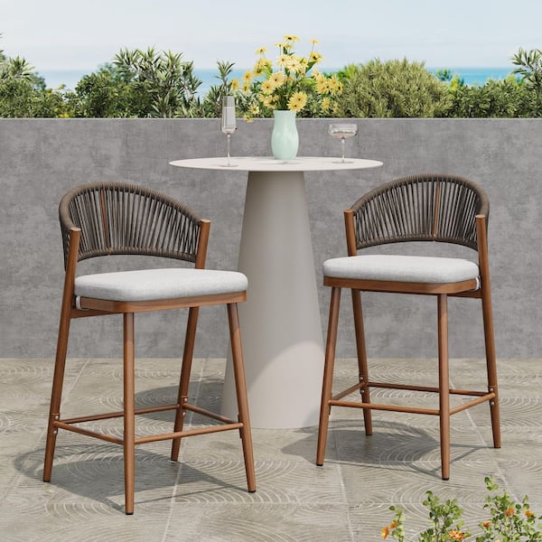 CHRISTOPHER KNIGHT HOME Chamberlain 26 in. Aluminum Patio Outdoor Bar Stool with Light Grey Cushion, Teak Finish, PE Rattan, Set of 2