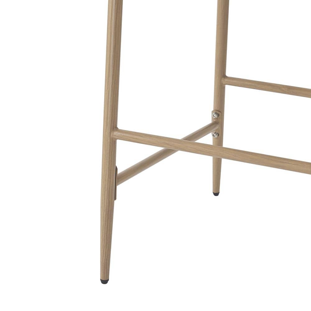 Close-up of the metal frame and joints of a bar stool.