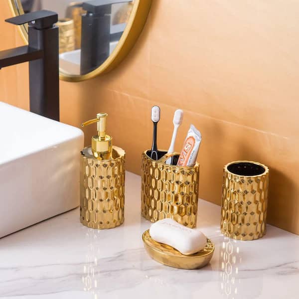 Dracelo 4-Piece Bathroom Accessory Set with Toothbrush Cup, Soap Dispenser, Soap Dish, Tumbler in Gold