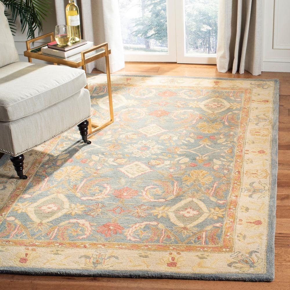 Handmade Light Blue and Ivory Floral Wool 6' x 9' Area Rug