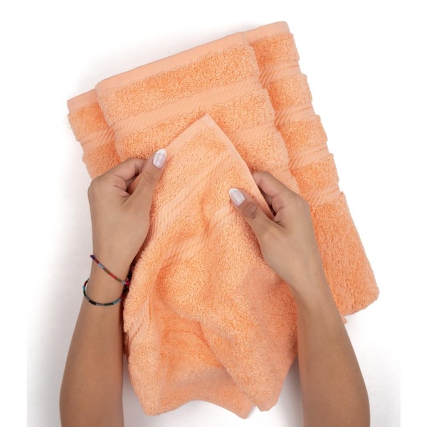 https://images.thdstatic.com/productImages/6cf0e04b-4c71-448b-b3bf-5d0d52a32c65/svn/malibu-peach-bath-towels-edis35x70mal-e24-4f_600.jpg